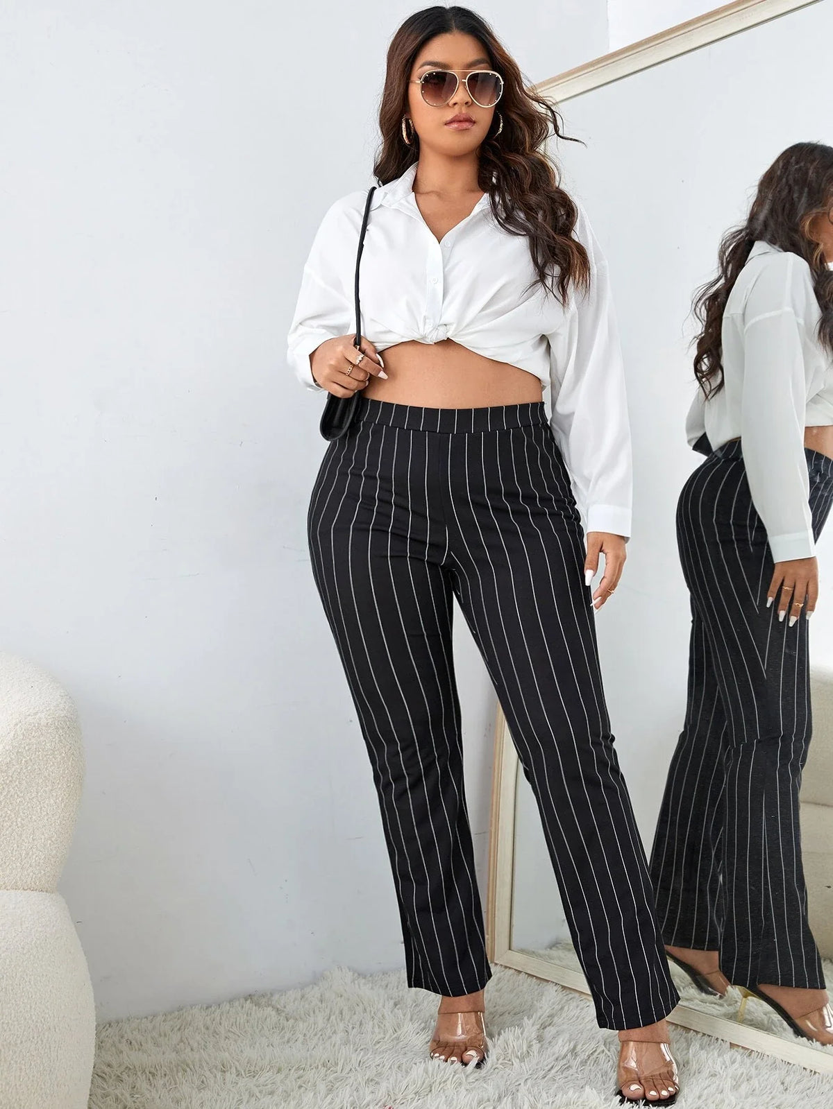 Pantaloni a gamba tagliata vita alta a righe verticali